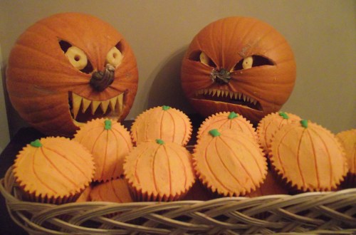 pumpkins guarding cupcakes